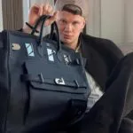 Erling Haaland con un bolso de lujo durante su llegada al Mundial 2026